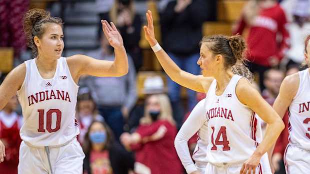 Indiana's Aleksa Gulbe and guard Ali Patberg high five